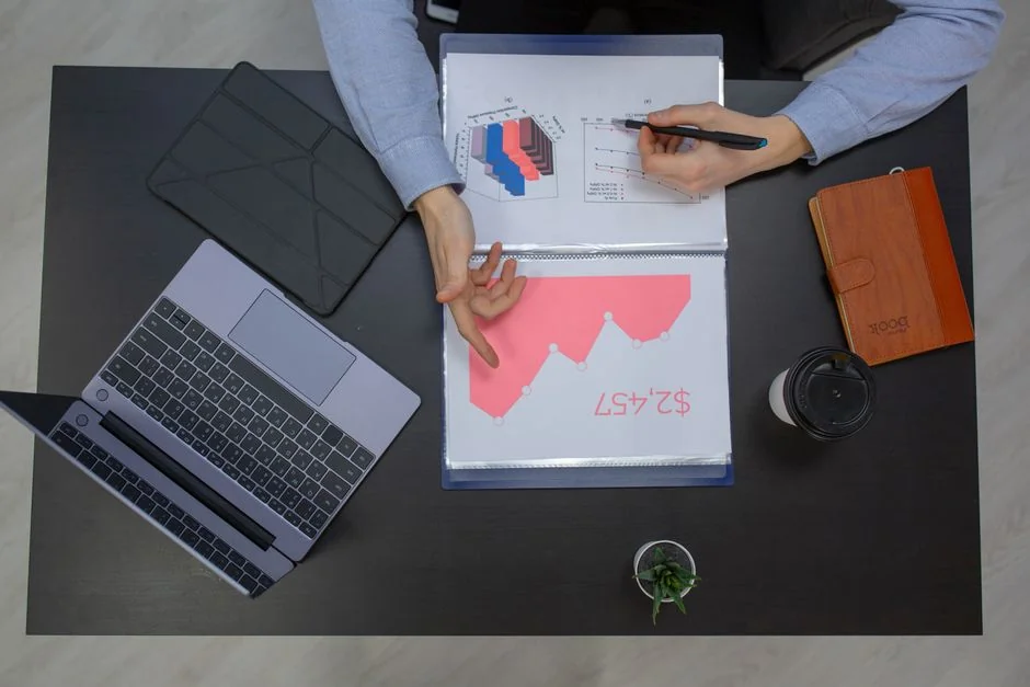 Vivid highlighters rest on a User-Generated Content note laid out on a wooden desk.