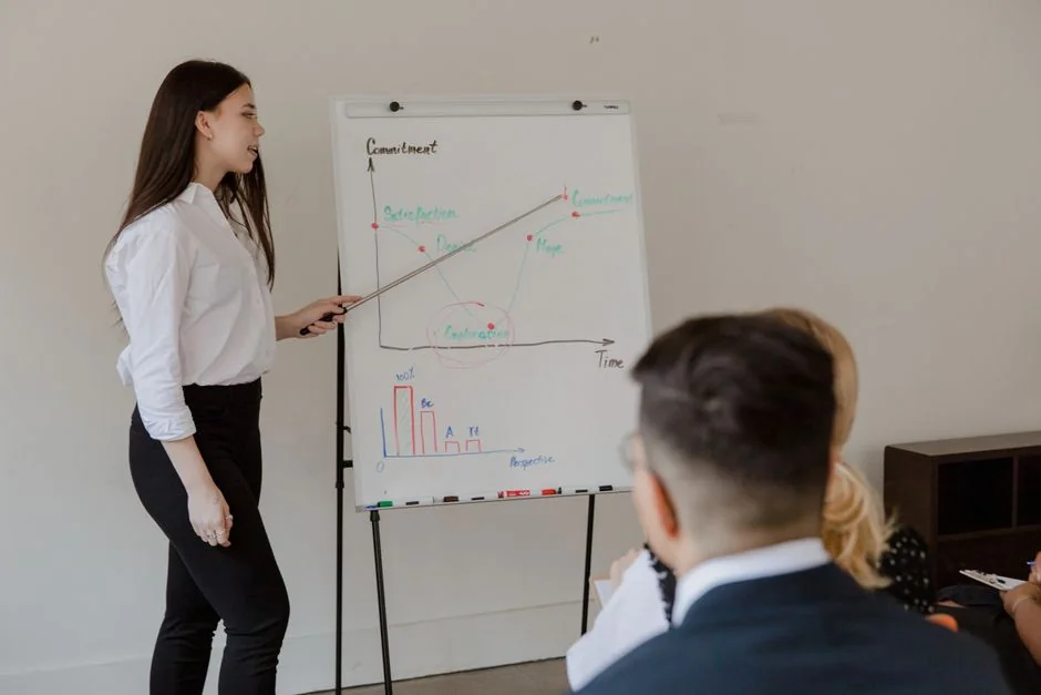 Group of business professionals collaborating in an office setting.